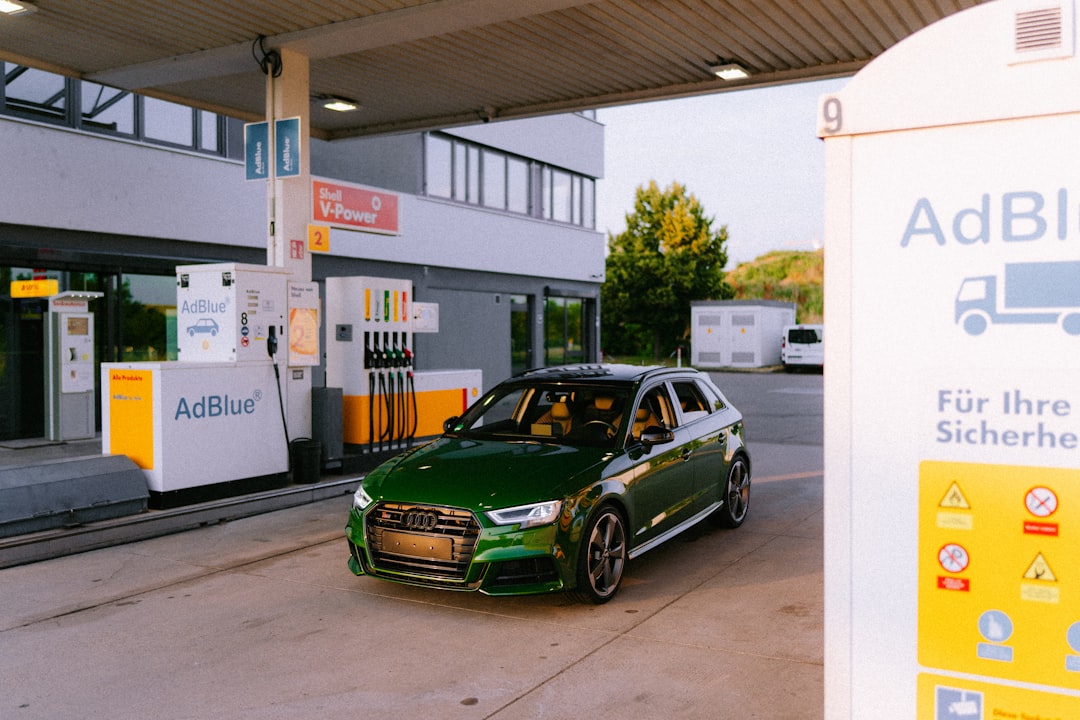 green-audi-car-at-a-shell-gas-station-qh6qpqt1oy8